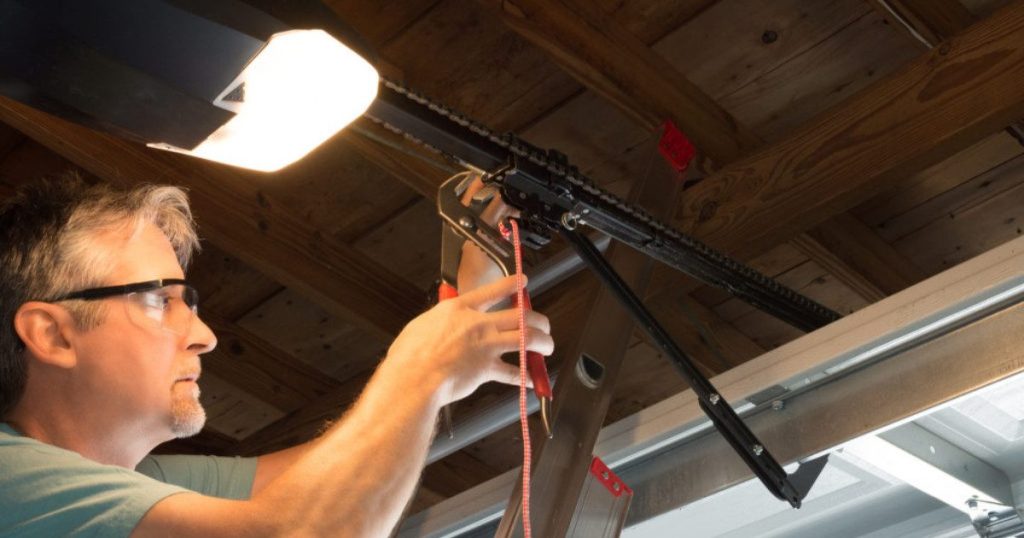expert repairing garage door opener