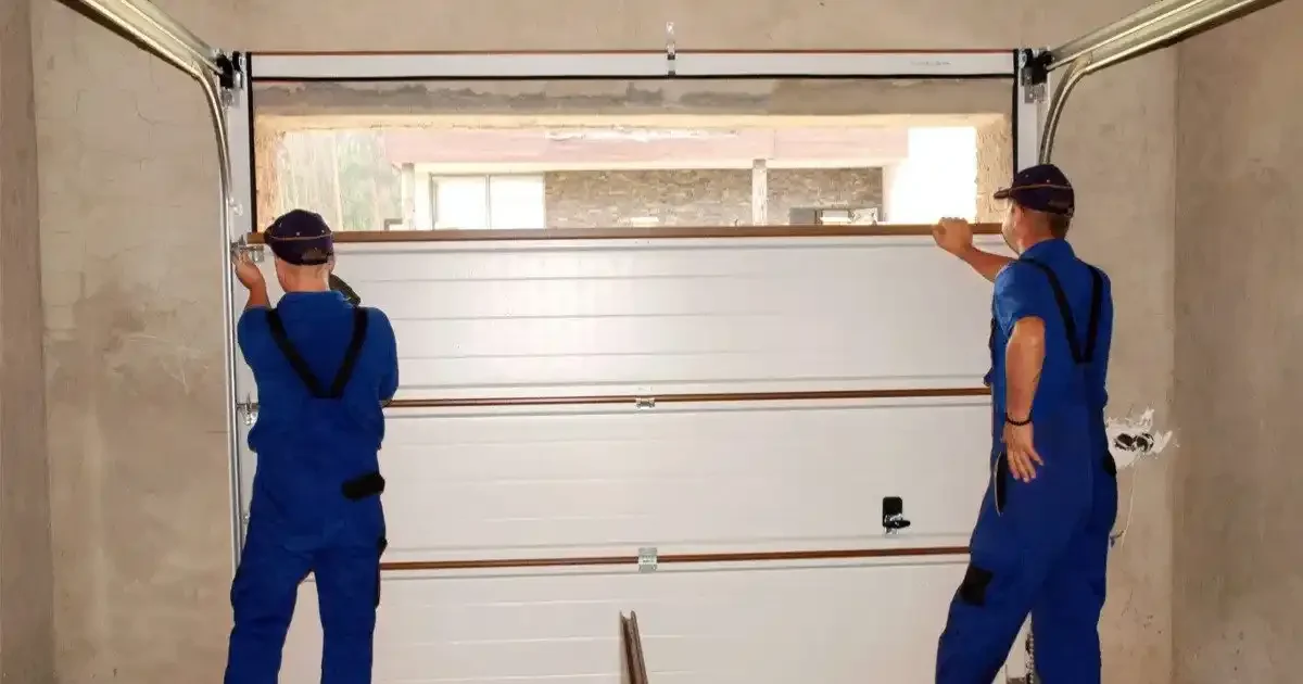 experts changing garage door cable