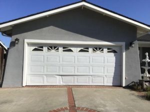 Garage door with a dented bottom panel
